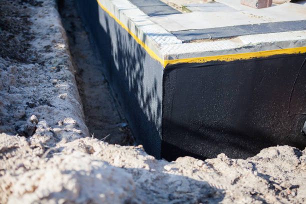 Professional Basement Waterproofing technician working in East Brunswick, NJ